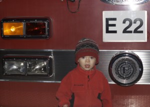 Richardson sets up Santa's Village by the civic center. We went on a freezing cold night.  Brenden's favorite part was this fire truck in the parking lot that all the kids were climbing on. Oh, and the cookie Mrs. Claus gave him!