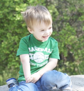 Enjoying the sun at the zoo with his dad.